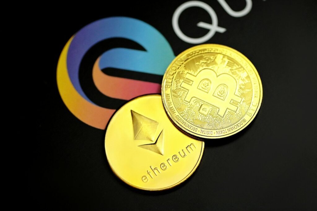 a close up of two gold bitcoins