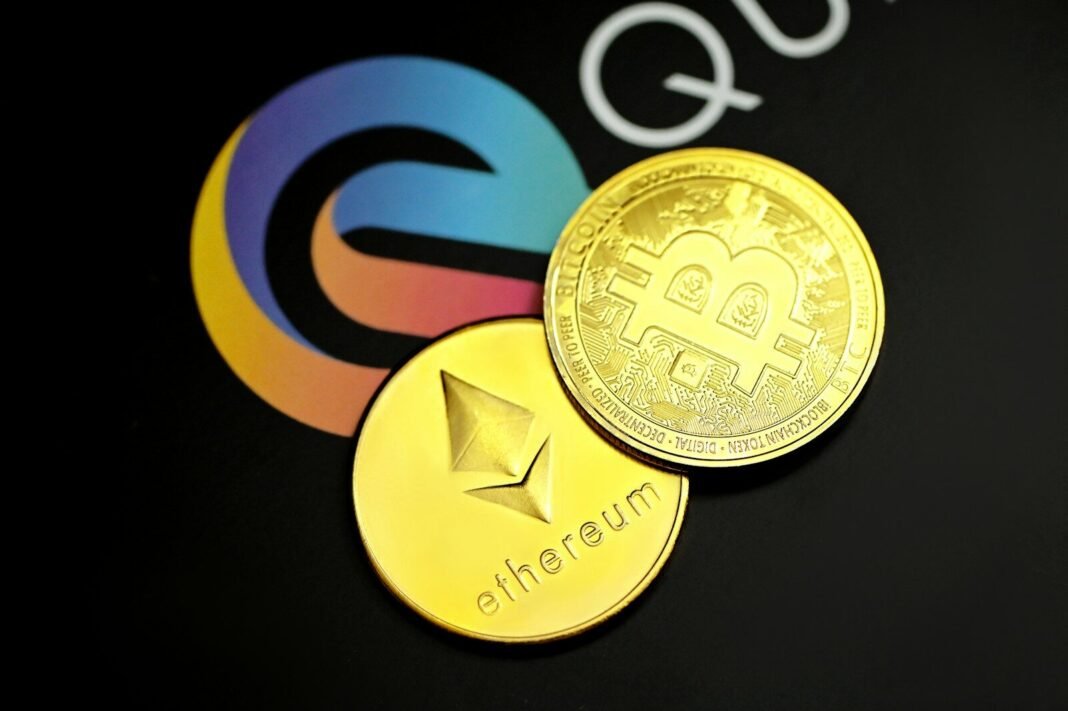 a close up of two gold bitcoins