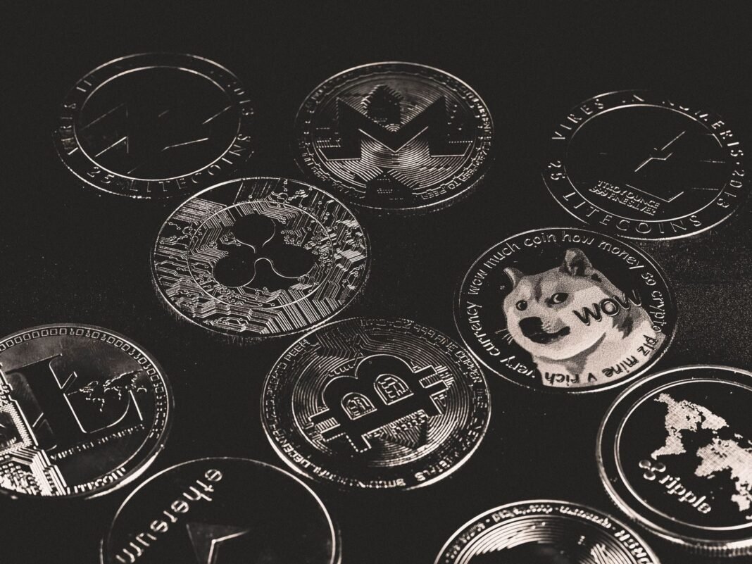 A collection of various cryptocurrency coins including Bitcoin, Ethereum, and Dogecoin.