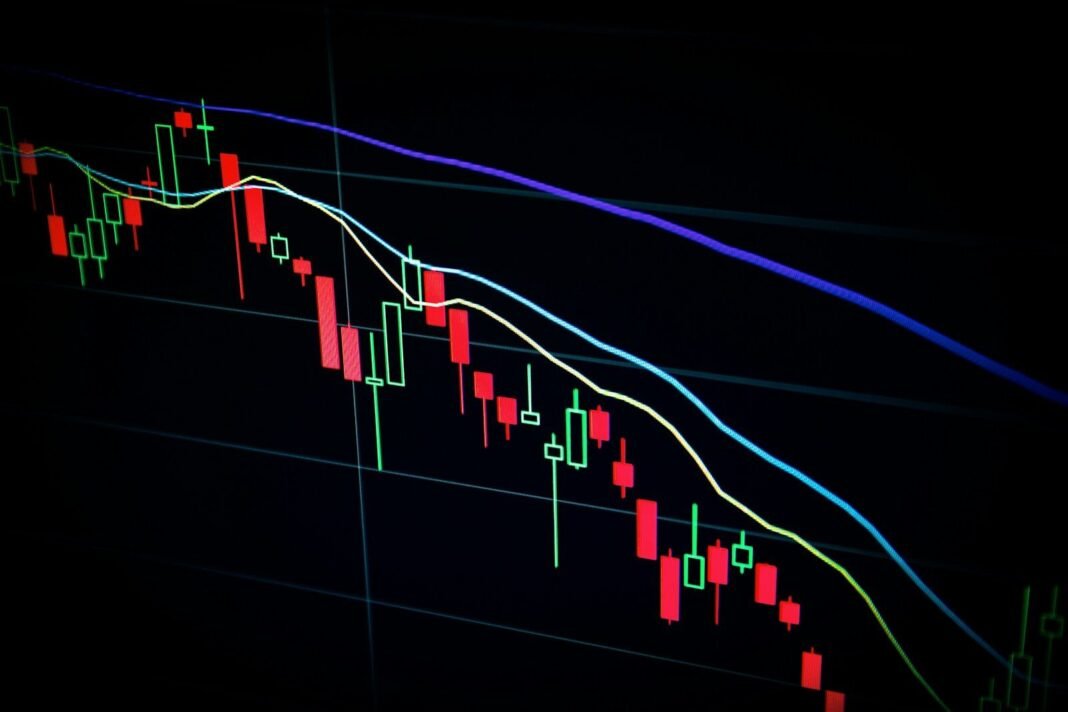 stock market candlestick chart on dark screen