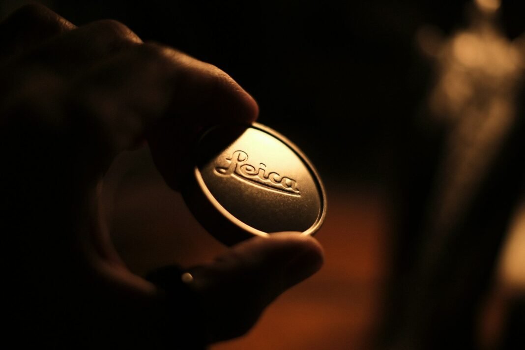 a close up of a person holding a button